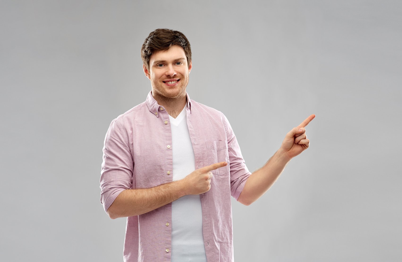 Smiling Young Man Showing Something